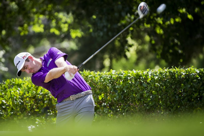 Defending tournament champion Brendon Todd hits his tee shot on the first hole during the...