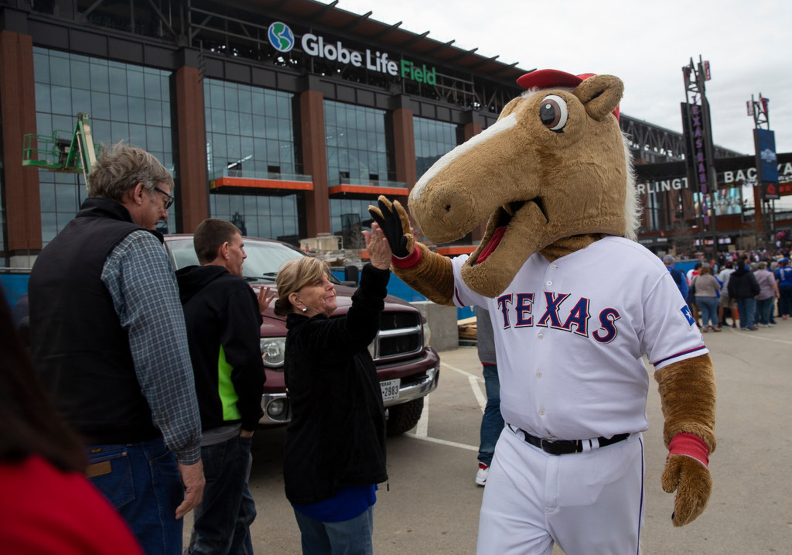 Rangers Captain high fives people waiting in line during the Rangers' Peek at the Park...