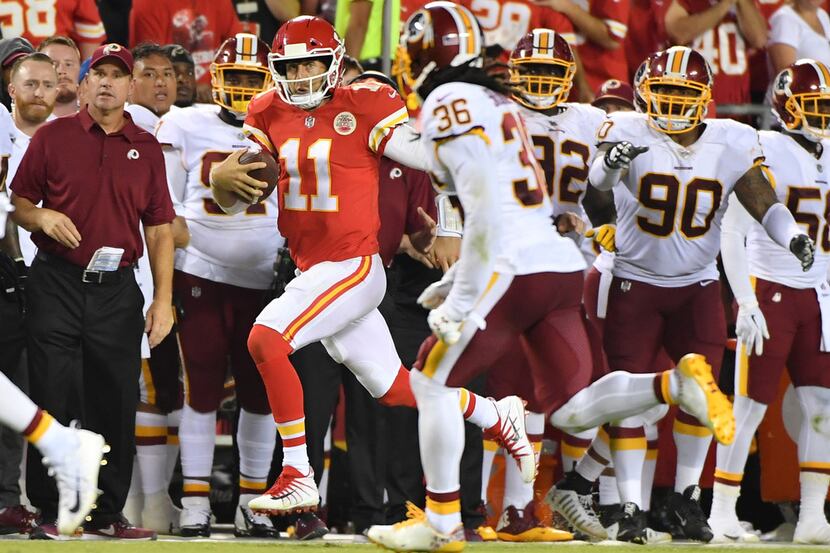 Kansas City Chiefs quarterback Alex Smith (11) scrambles for a first down as Washington...