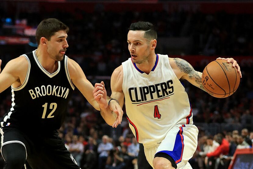 LOS ANGELES, CA - NOVEMBER 14:  J.J. Redick #4 of the Los Angeles Clippers dribbles past Joe...