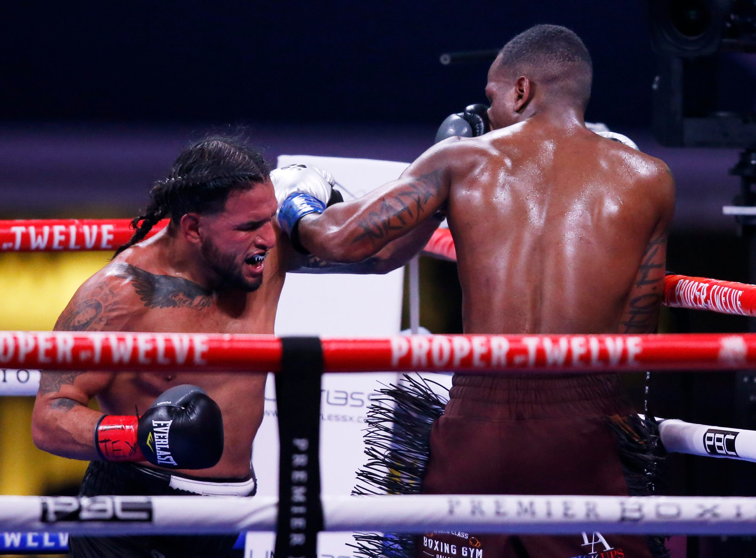 Marco Delgado punches Burley Brooks during the sixth round at AT&T Stadium on Saturday,...