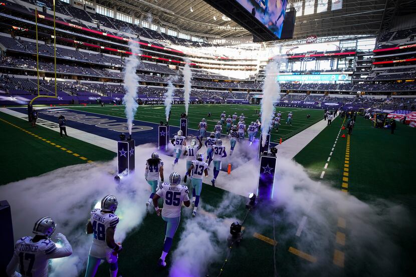 The Dallas Cowboys take the field to face the Philadelphia Eagles in an NFL football game at...