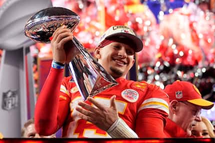 FILE - Kansas City Chiefs quarterback Patrick Mahomes celebrates with the trophy after the...