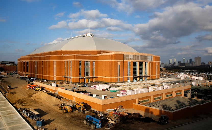 The Fort Worth skyline (right) is visible as the new Dickies Arena is under construction...