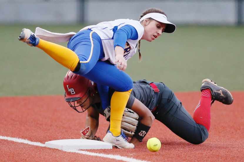Frisco sophomore shortstop Taylor Trosclair (8) is unable to catch the throw from home as...