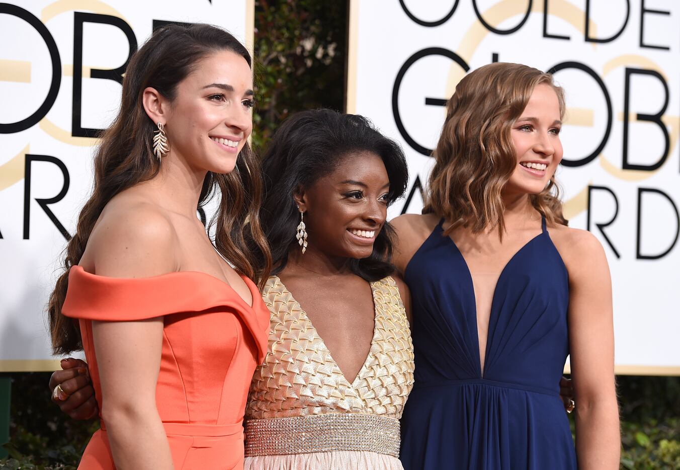 Aly Raisman, from left, Simone Biles and Madison Kocian arrive at the 74th annual Golden...