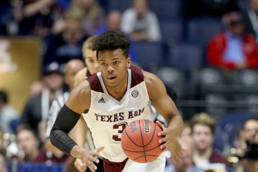 NASHVILLE, TN - MARCH 11:  Admon Gilder #3 of the Texas A&M Aggies dribbles the ball in the...