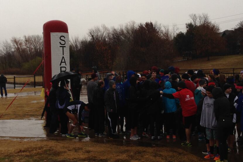 The rain didn't dampen the spirits of these runners. The sun shone in their hearts. (Paul...
