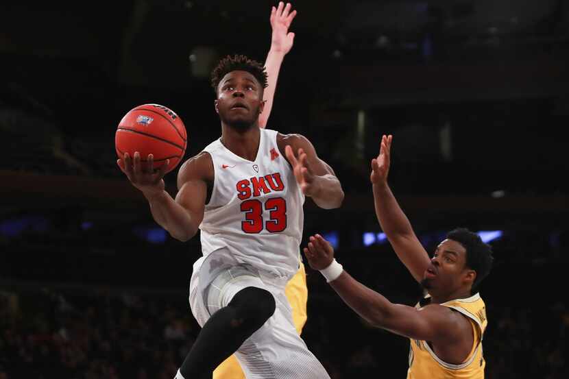 NEW YORK, NY - NOVEMBER 18:  Semi Ojeleye #33 of the Southern Methodist Mustangs puts up a...