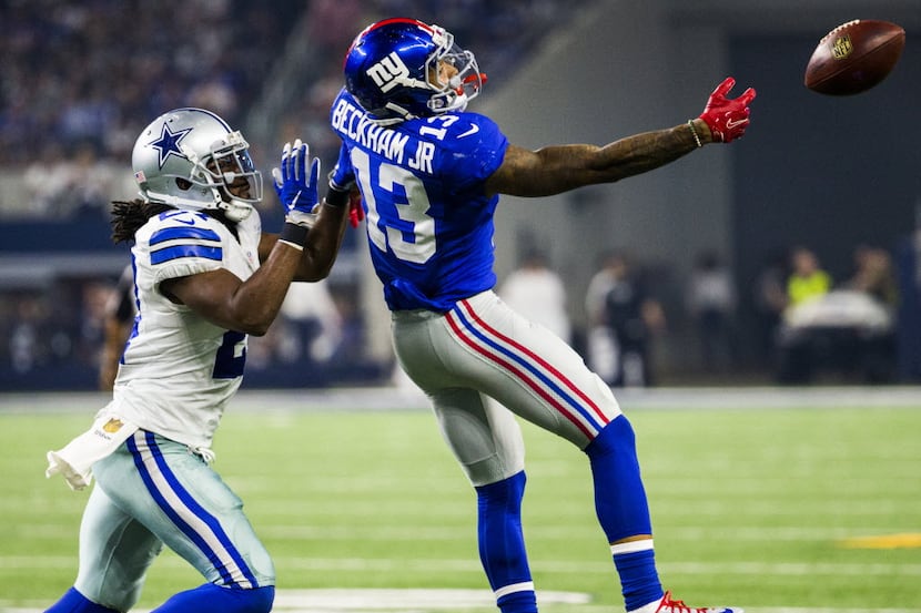 Dallas Cowboys free safety J.J. Wilcox (27) pushes New York Giants wide receiver Odell...