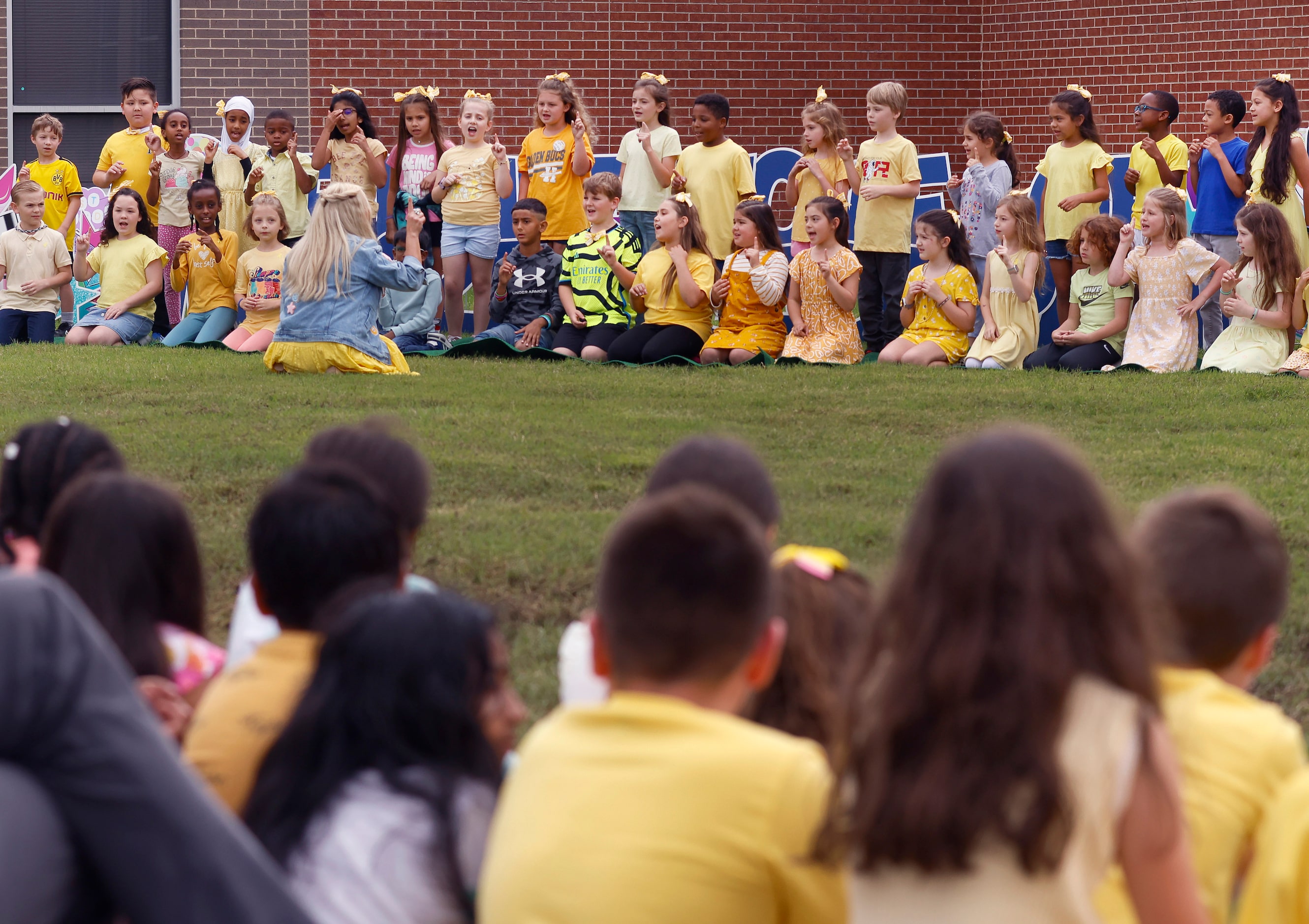 Seconds graders sing ‘The Sweetest Little Sisters’ written by and led by teacher Bobbie Jo...