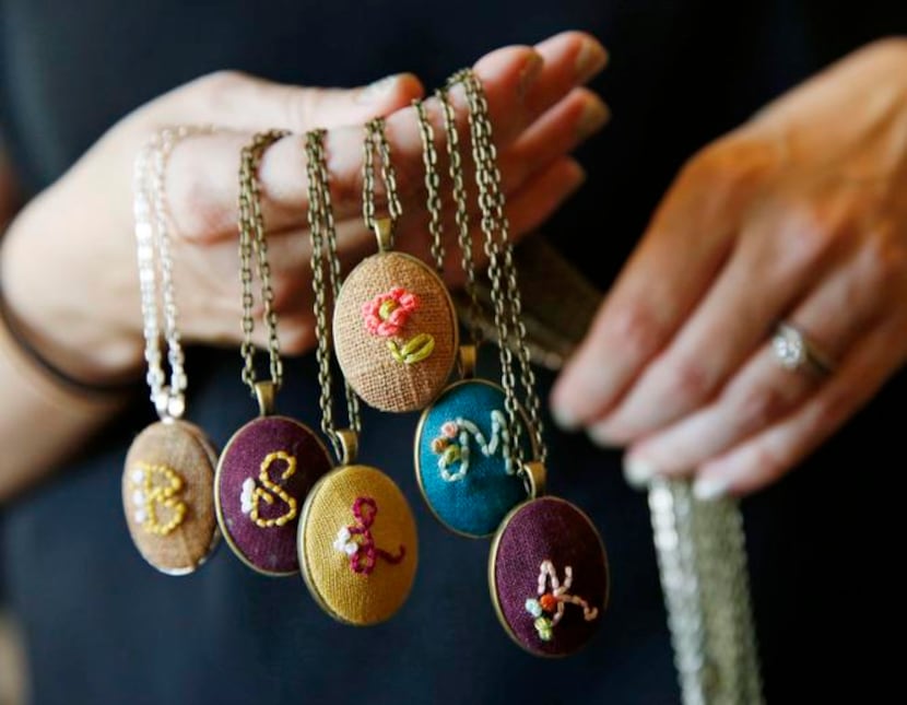 
In addition to taking custom orders, Culver sells embroidered pendant necklaces on her...