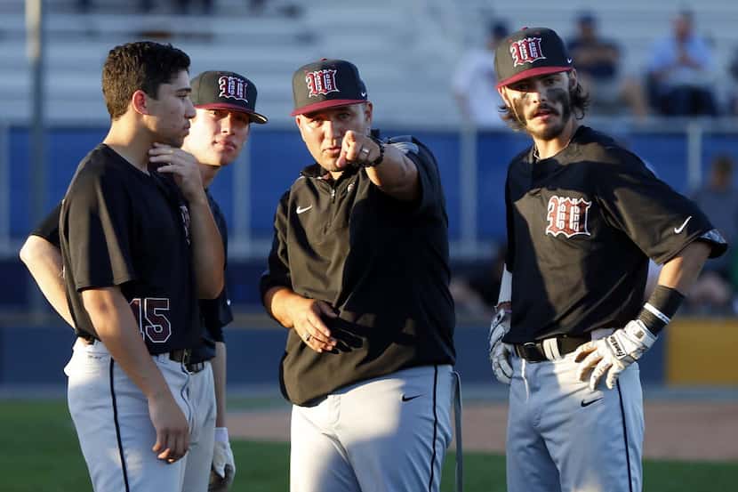 Wylie head coach Jonathan Cantu (second from right) instructs his players where the...