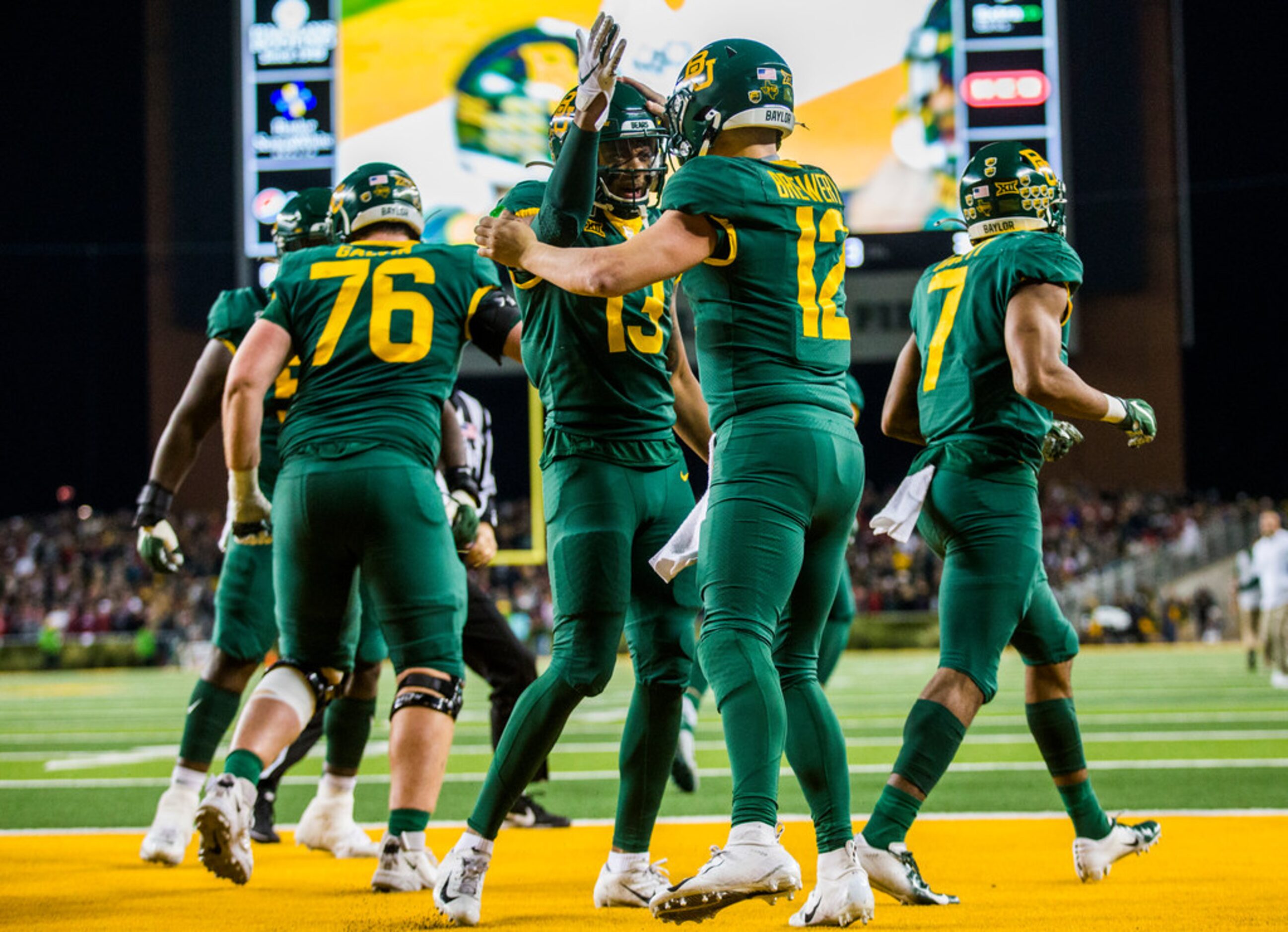 Baylor Bears quarterback Charlie Brewer (12) celebrates a touchdown with wide receiver R.J....