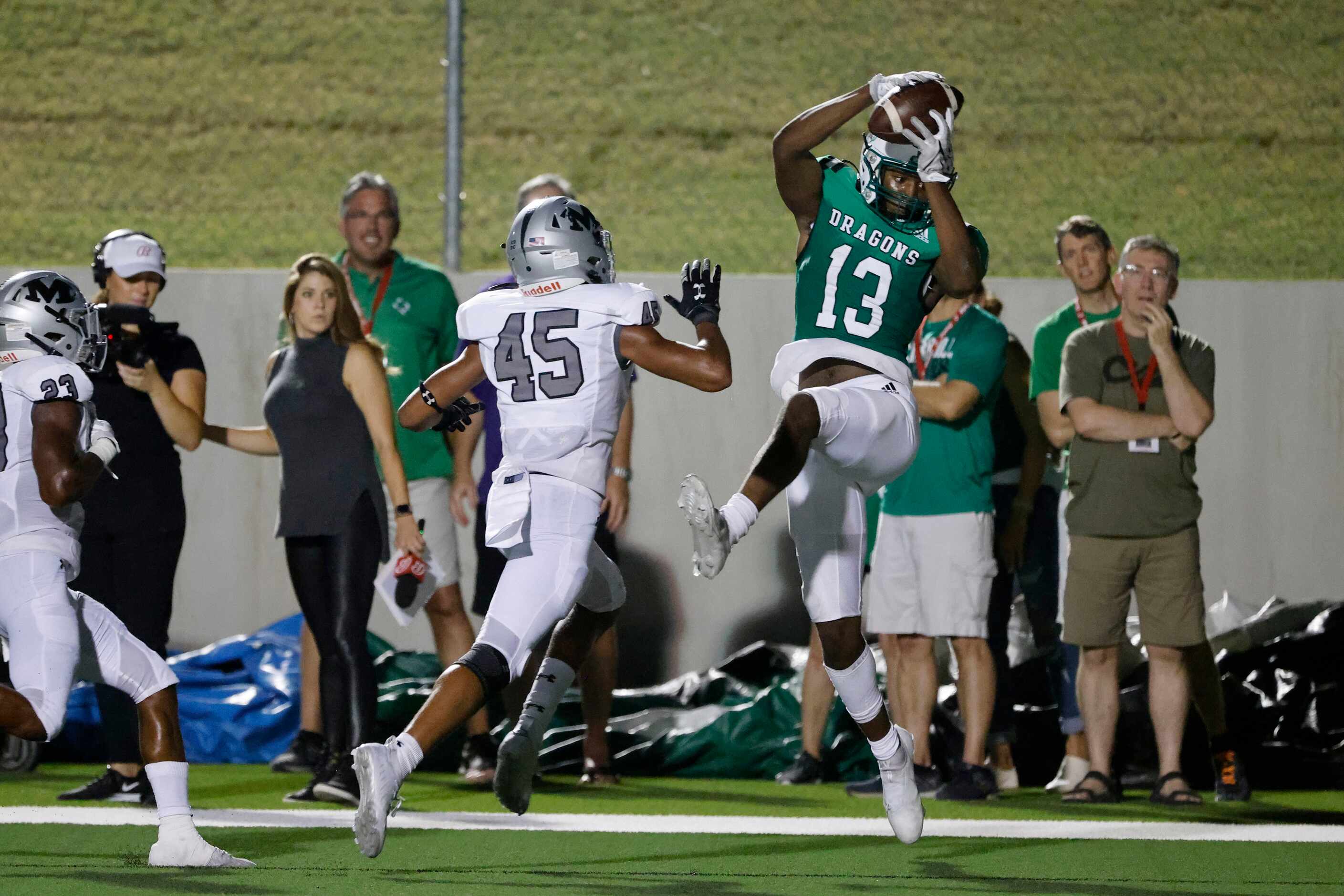 Southlake Carroll receiver RJ Maryland (13) catches a touchdown pass in front of Arlington...