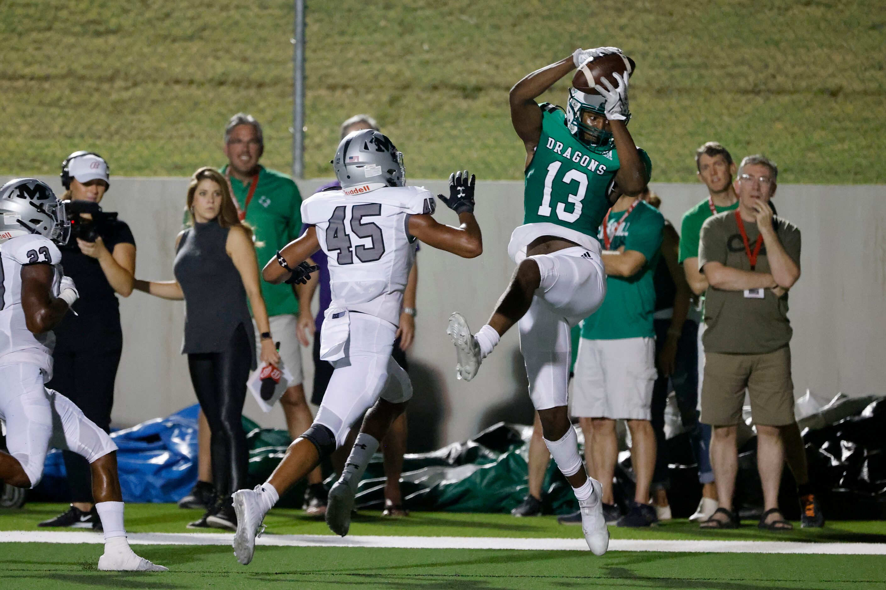 Southlake Carroll receiver RJ Maryland (13) catches a touchdown pass in front of Arlington...