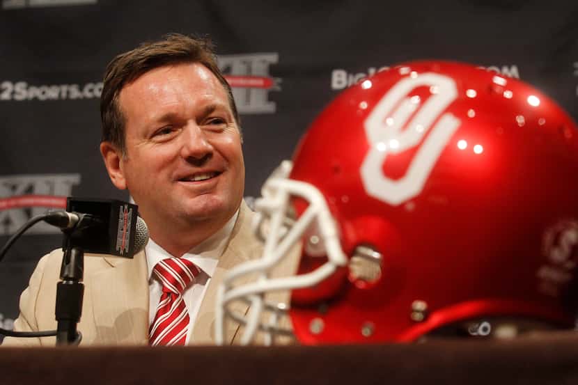 Oklahoma football coach Bob Stoops speaks during the Big 12 media days at the Omni Hotel in...