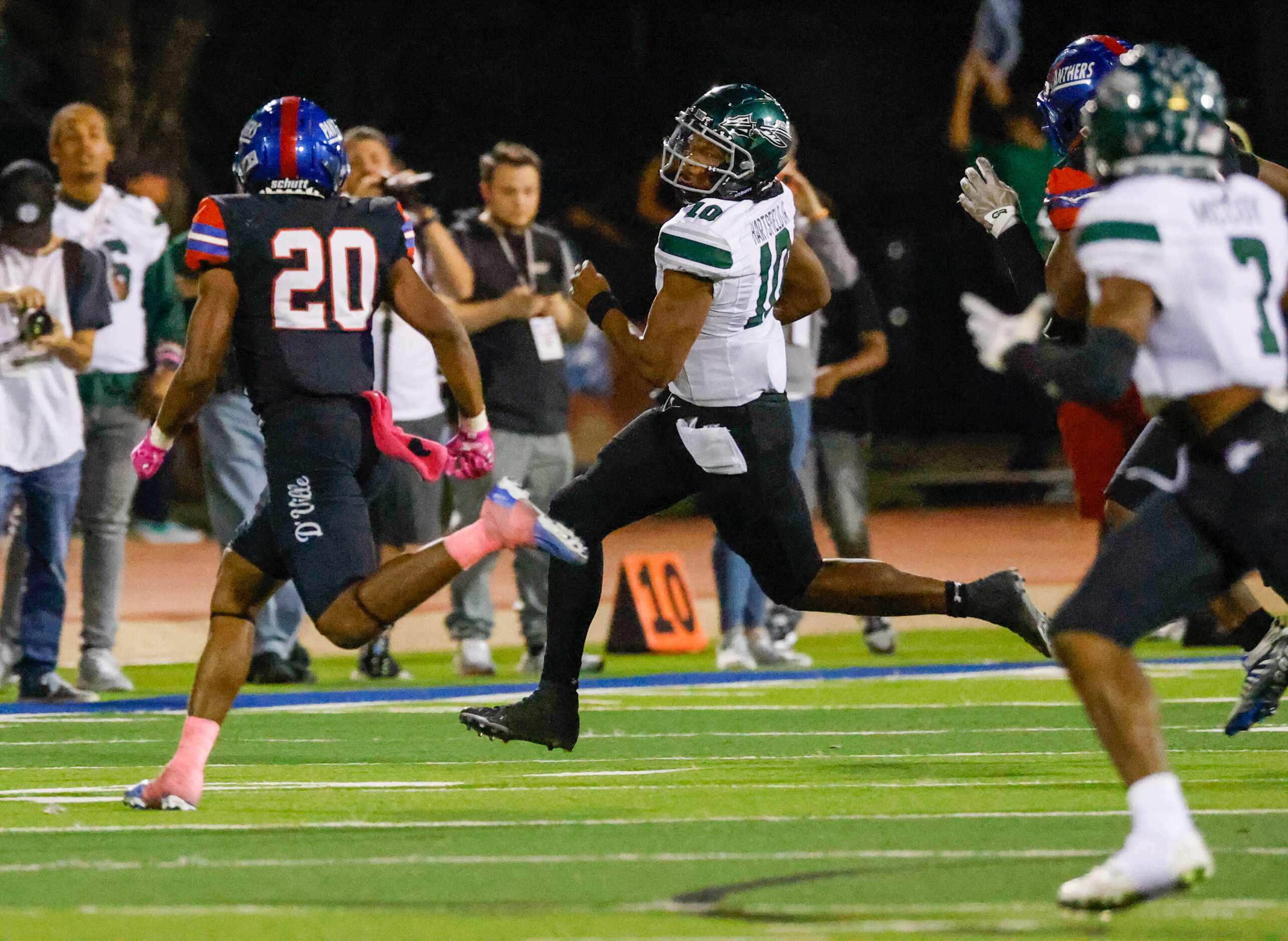 Waxahachie quarterback Roderick Hartsfield, Jr. (10) runs toward the sideline to avoid...