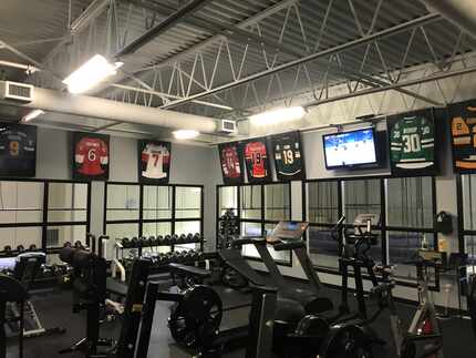 Ben Bishop and Matthew Tkachuk's jerseys are framed at Elevated Performance in St. Louis.