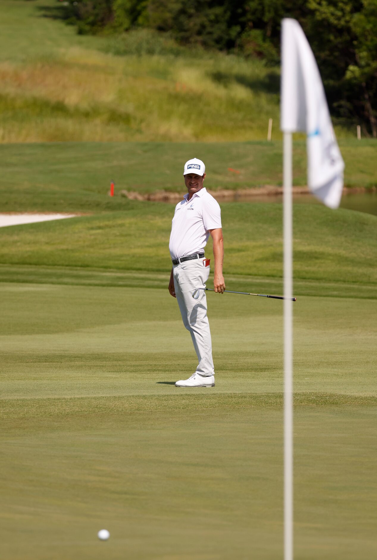 Harris English watches his ball on the 14th hole during round 3 of the AT&T Byron Nelson  at...