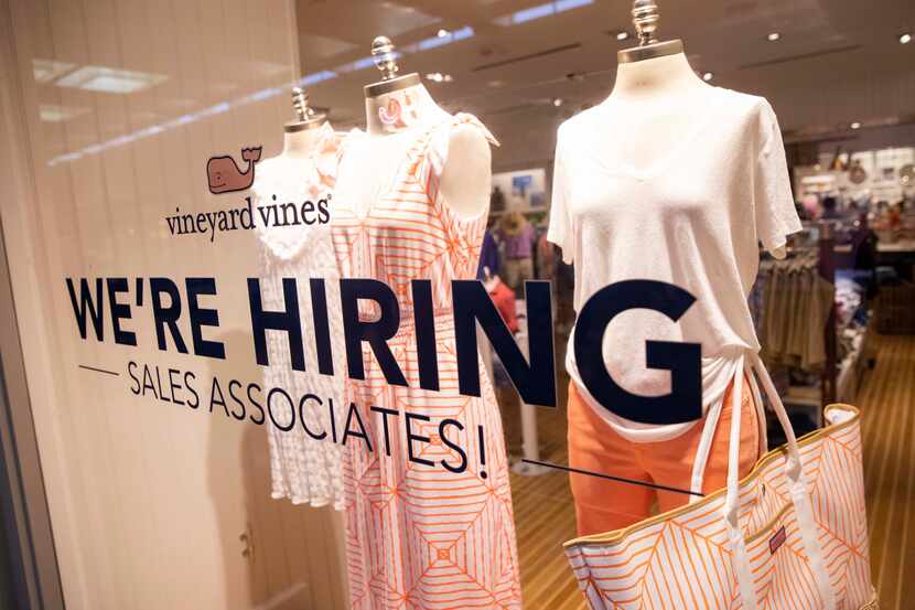 A hiring notice on the window at Vineyard Vines in Dallas' NorthPark Center .