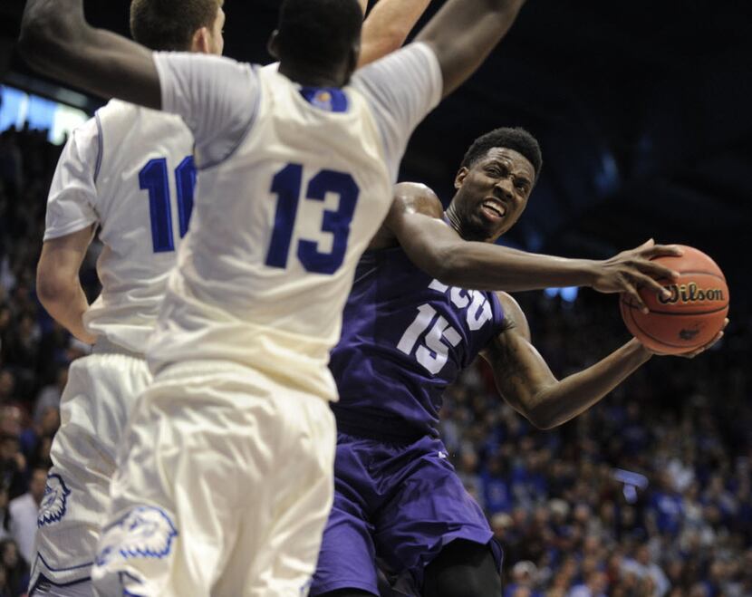 LAWRENCE, KS - JANUARY 16:  JD Miller #15 of the TCU Horned Frogs looks to shoot against...