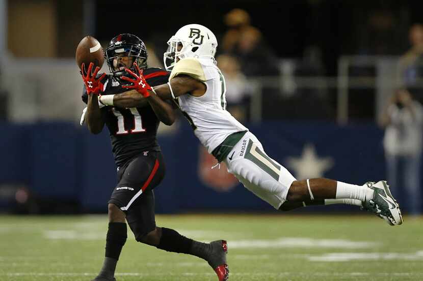 Baylor Bears safety Terrell Burt (13) breaks up a pass intended to Texas Tech Red Raiders...