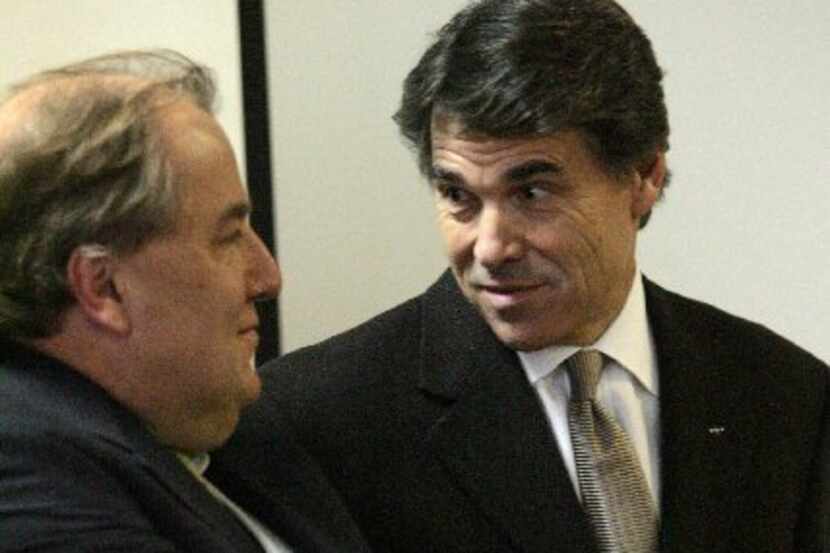 Former Texas Gov. Rick Perry, shown here in 2007 with Michael Morris of the North Central...