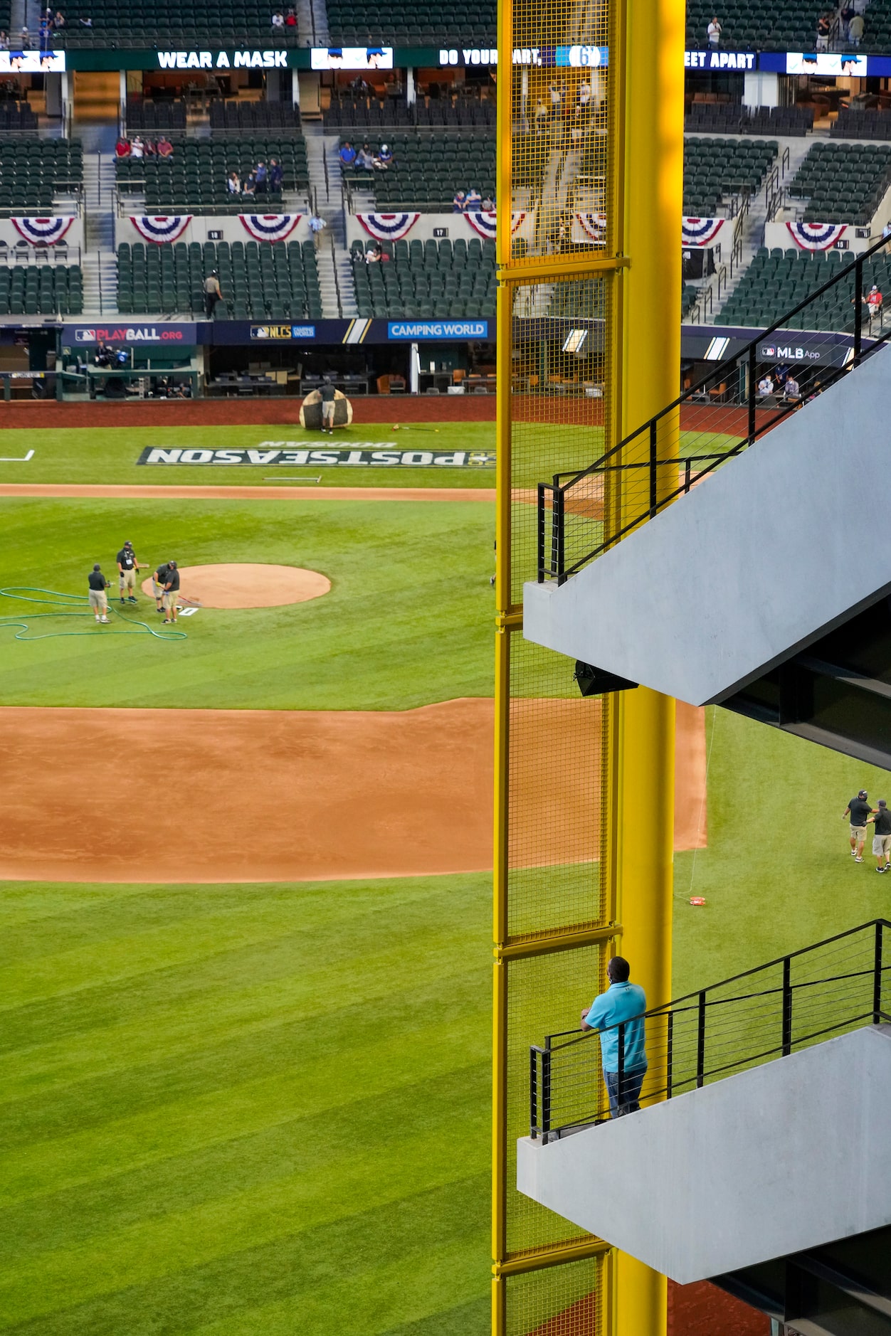 Fans watch batting practice before Game 1 of a National League Championship Series between...