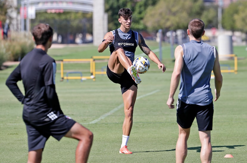 Peter Musa participates in a drill during FC Dallas practice at the practice field near...