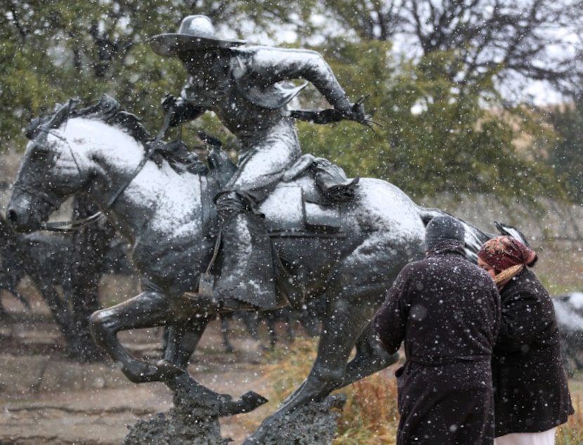 Armando and Gabriela Cruz braved Tuesday’s snow for a visit to Pioneer Plaza in downtown...