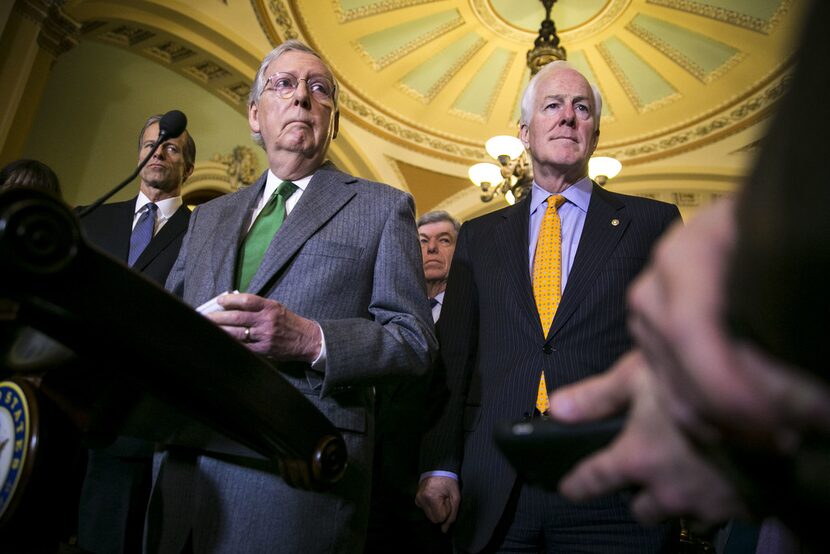 Senate Majority Leader Mitch McConnell, R-Ky., and Sen. John Cornyn, R-Texas, speak to...