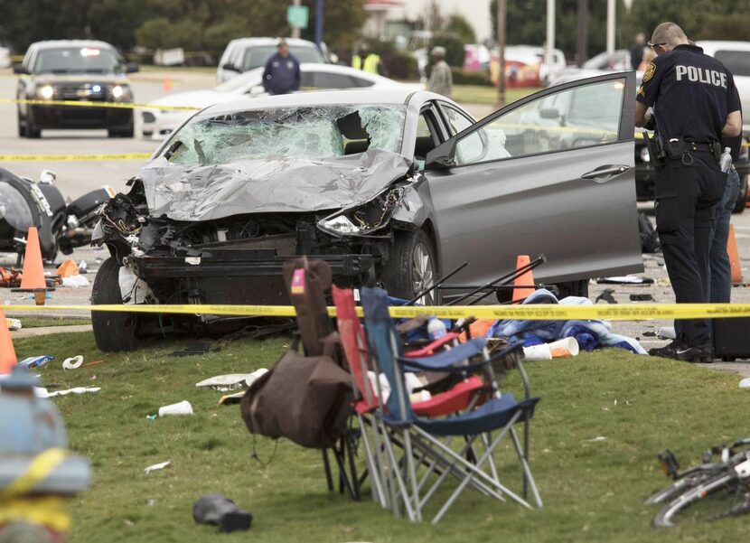 
Police said a woman drove her car into an unmanned police motorcycle (at left) before...