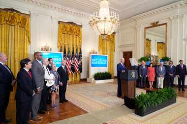 President Joe Biden (center) spoke about an executive order in the East Room at the White...