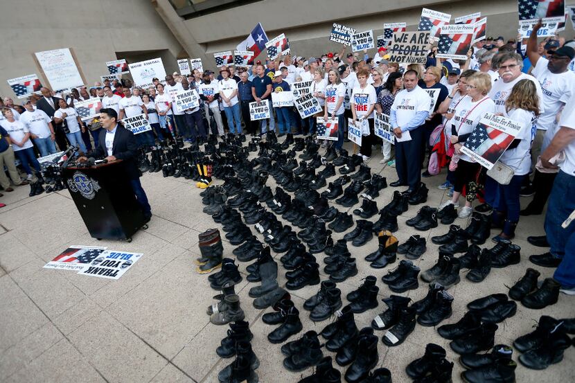 Dallas police and fire retirees hold a rally against Mayor Mike Rawlings' letter, which...
