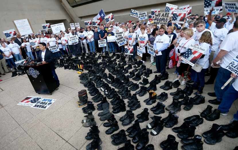 Dallas police and fire retirees hold a rally against Mayor Mike Rawlings' letter, which...