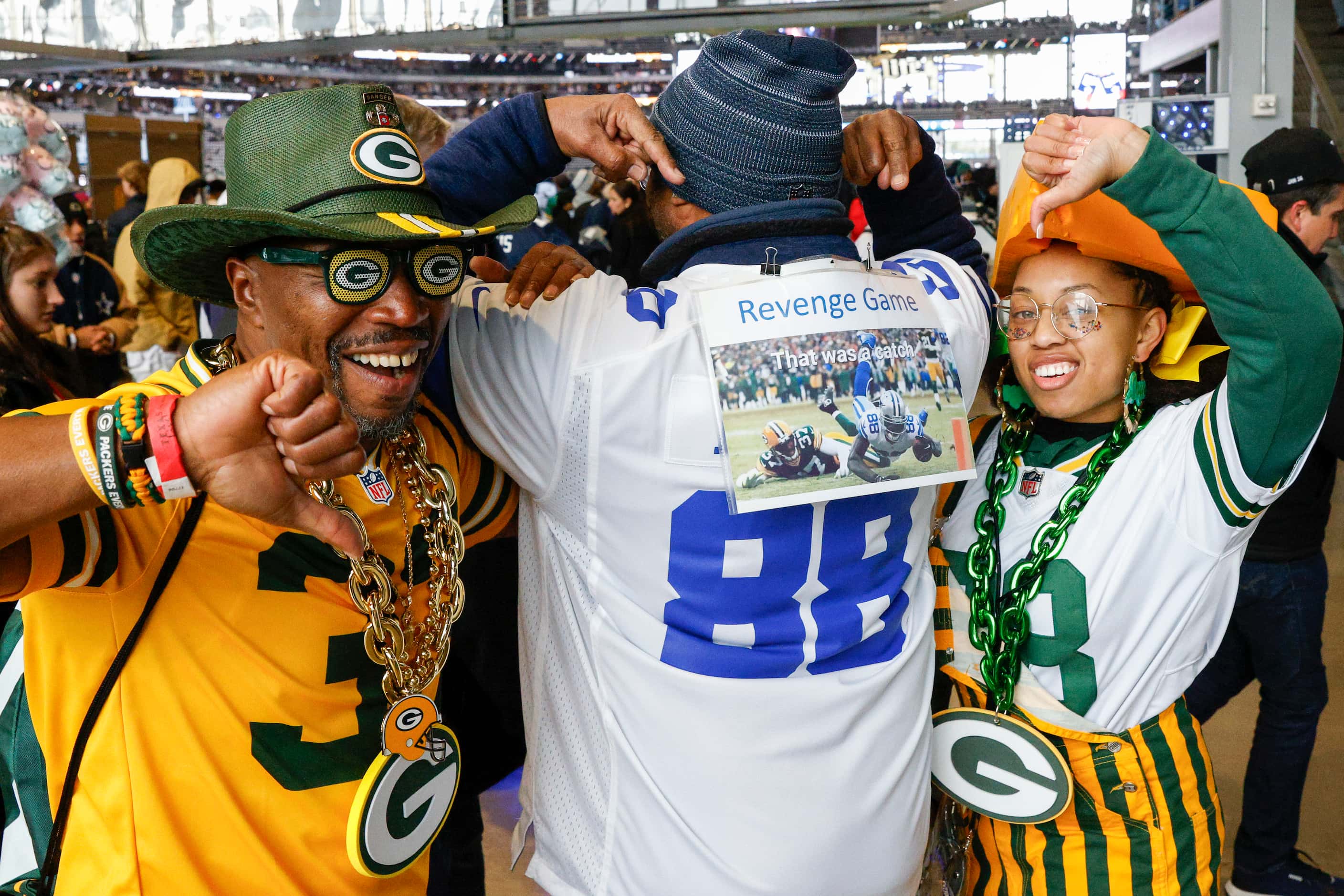 Winston Brown of North Carolina (center) points to a 2012 photo of Dallas Cowboys wide...