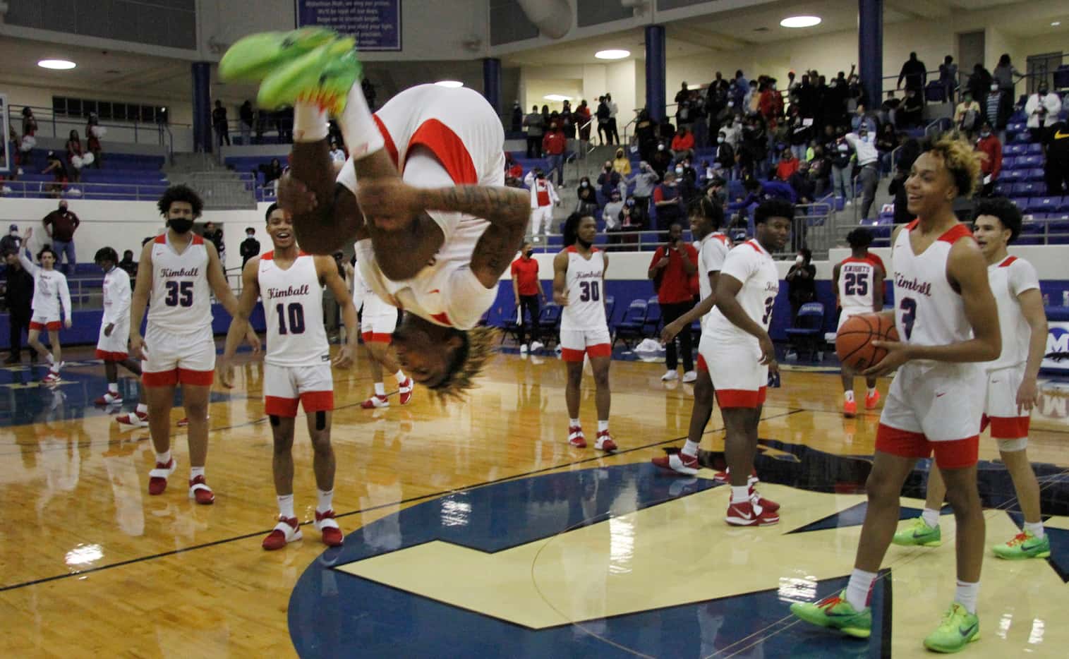 Dallas Kimball guard Arterio Morris (2) does a backflip at mid court as he celebrated with...