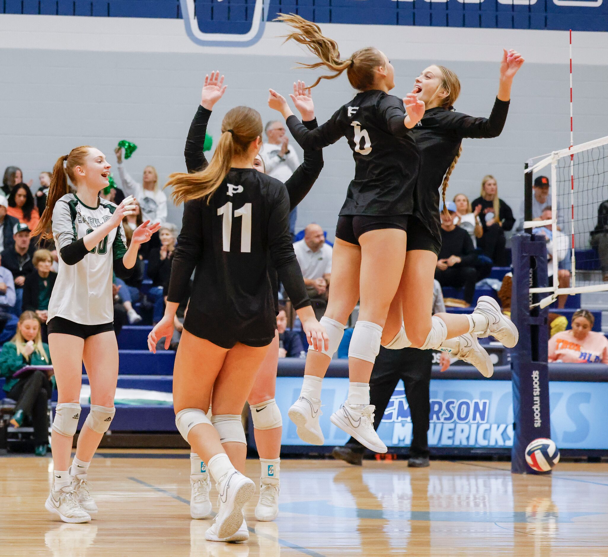 Prosper high’s players including Keely Harrington (center right) and Sydney Thornton (right)...