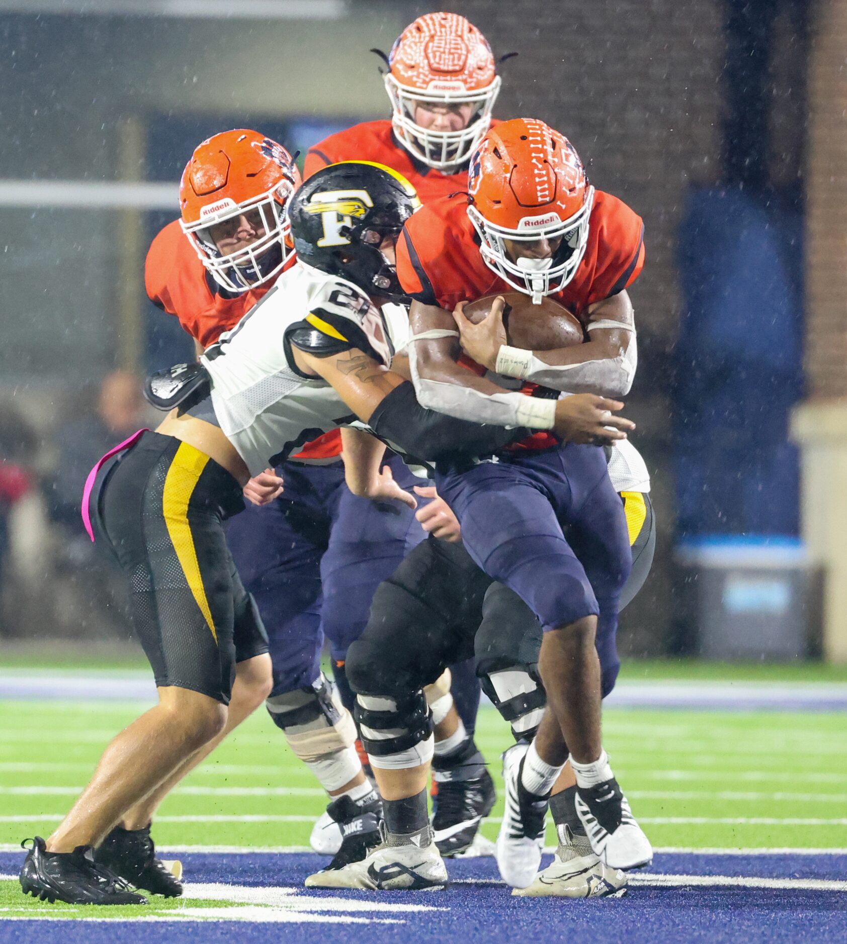 Forney defensive back Caiden Roberts (21) tackles McKinney North running back Jayden Walker...