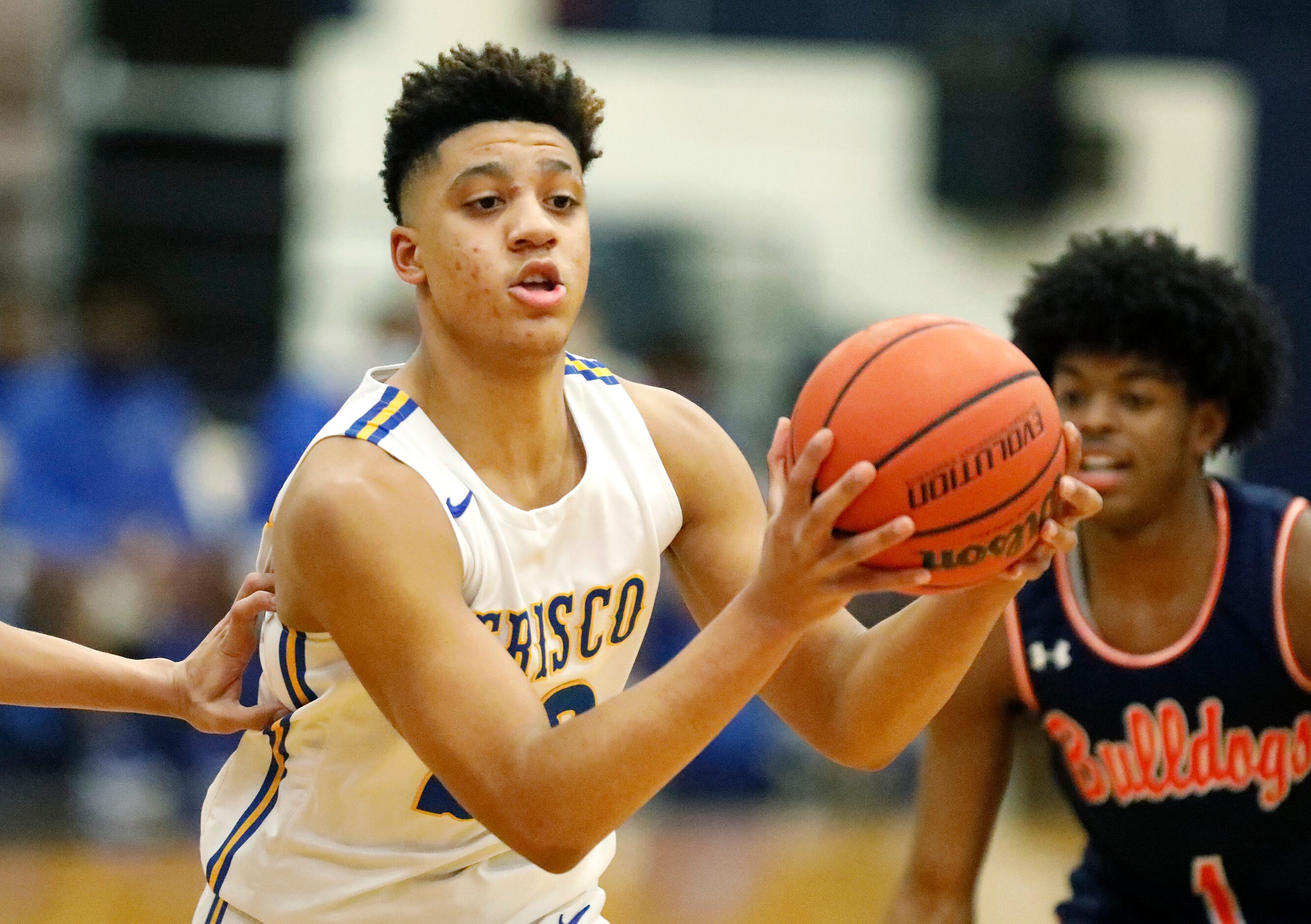 Frisco High School forward Jovani Benae (23) makes a pass during the first half as McKinney...