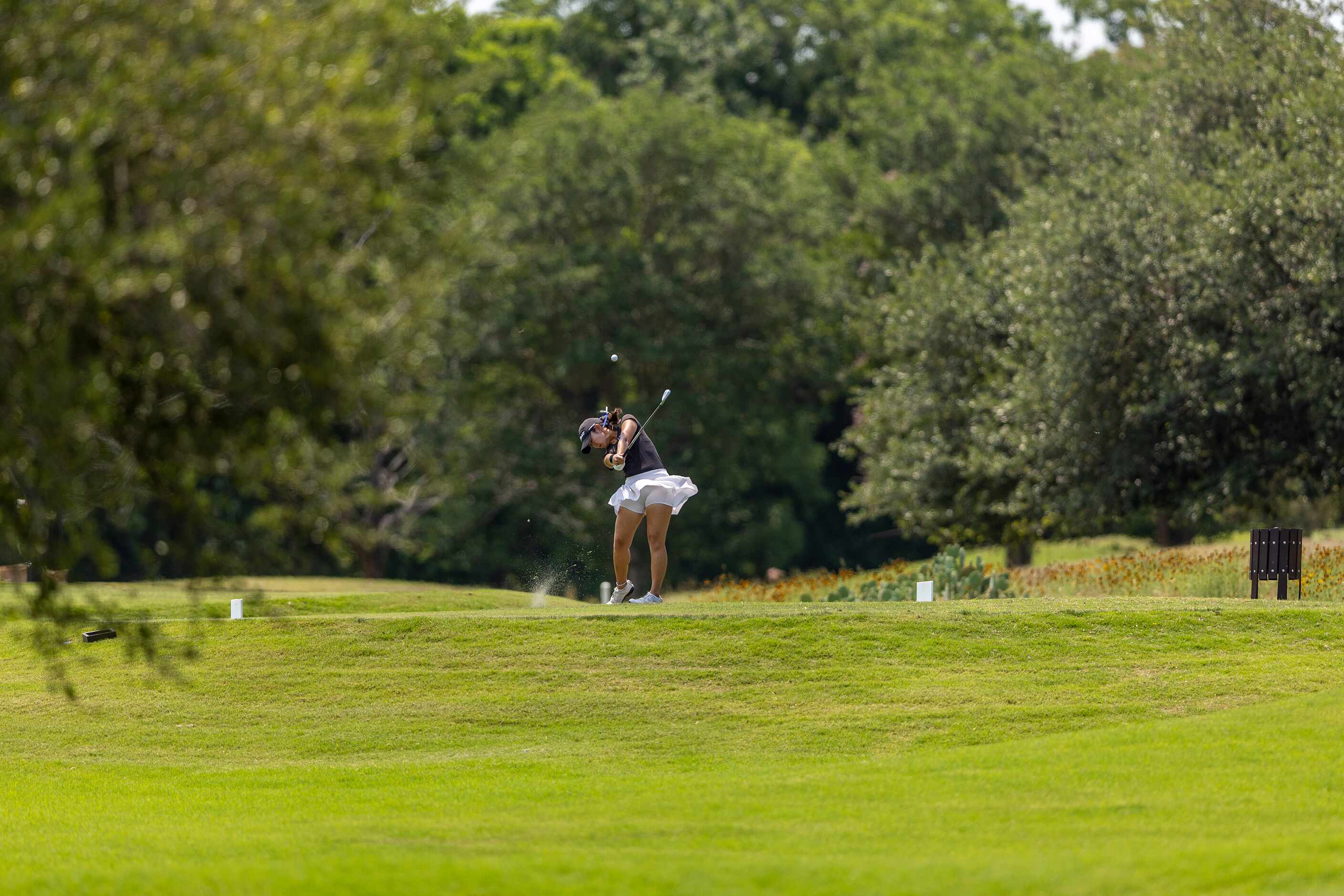 Hebron’s Estelle Seon hits from the 8th tee box during the 6A girls state golf tournament in...