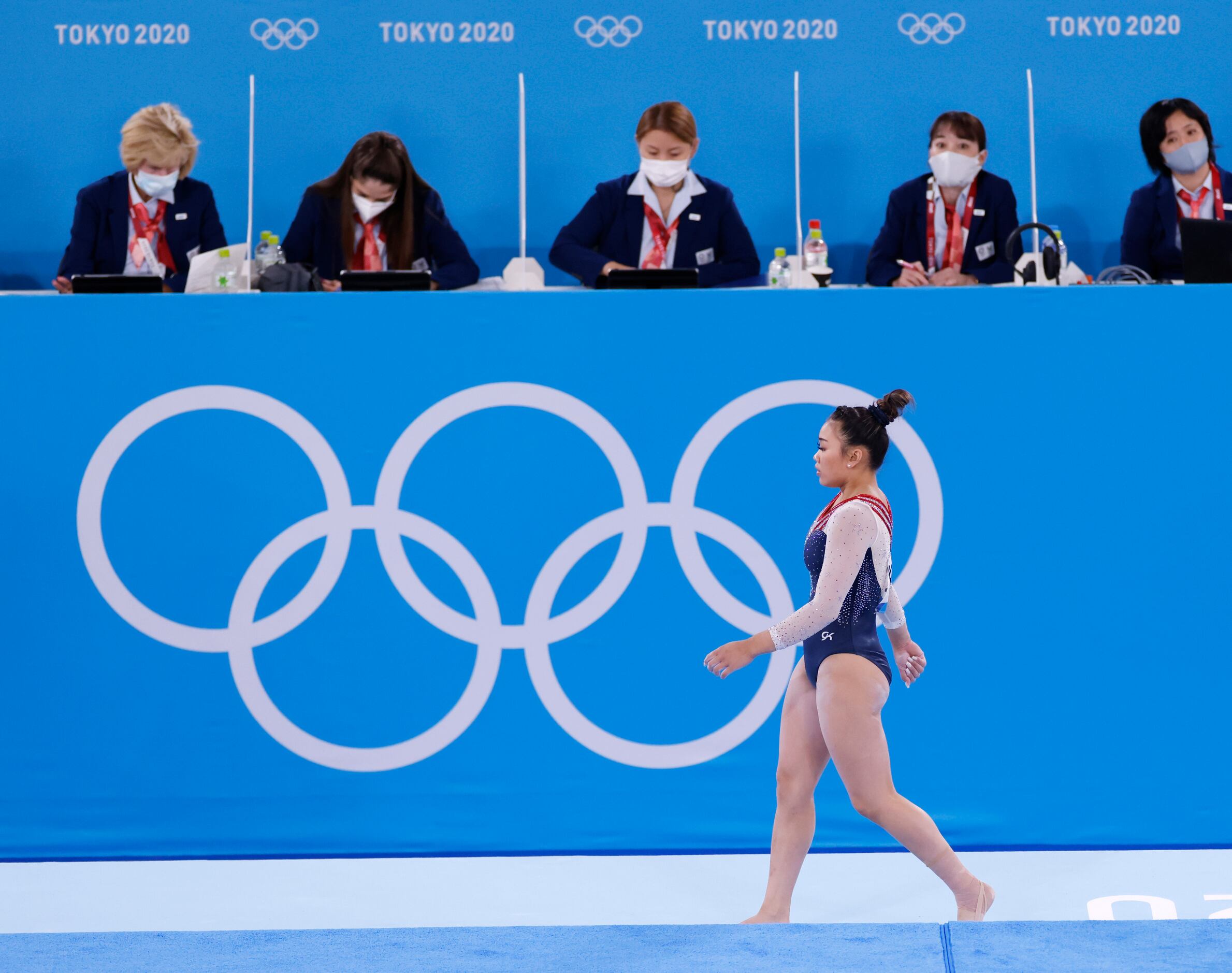 USA’s Sunisa Lee makes her way off the floor after completing her routine during the women’s...