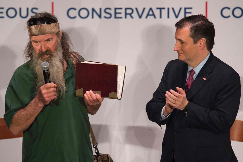 
Duck Dynasty star Phil Robertson held his Bible aloft as he discussed his support for Ted...