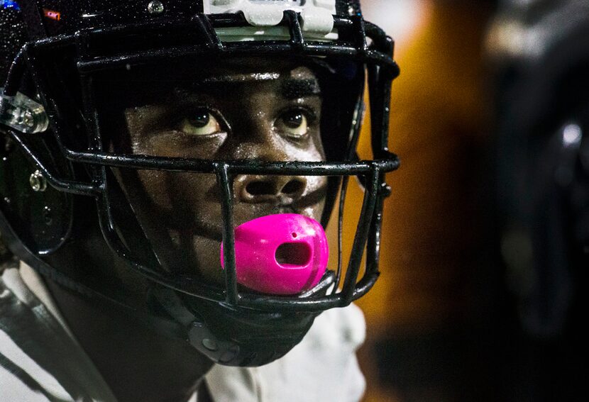 West Mesquite wide receiver Dylan Wright (9) watches the game during a high school football...