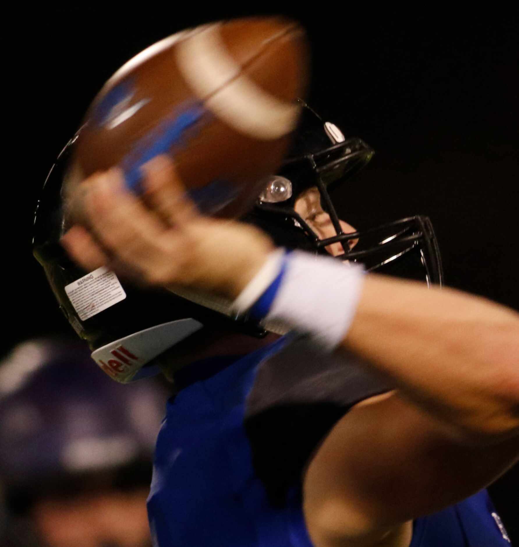 Trophy Club Byron Nelson quarterback Hudson White (2) launches a pass downfield during first...
