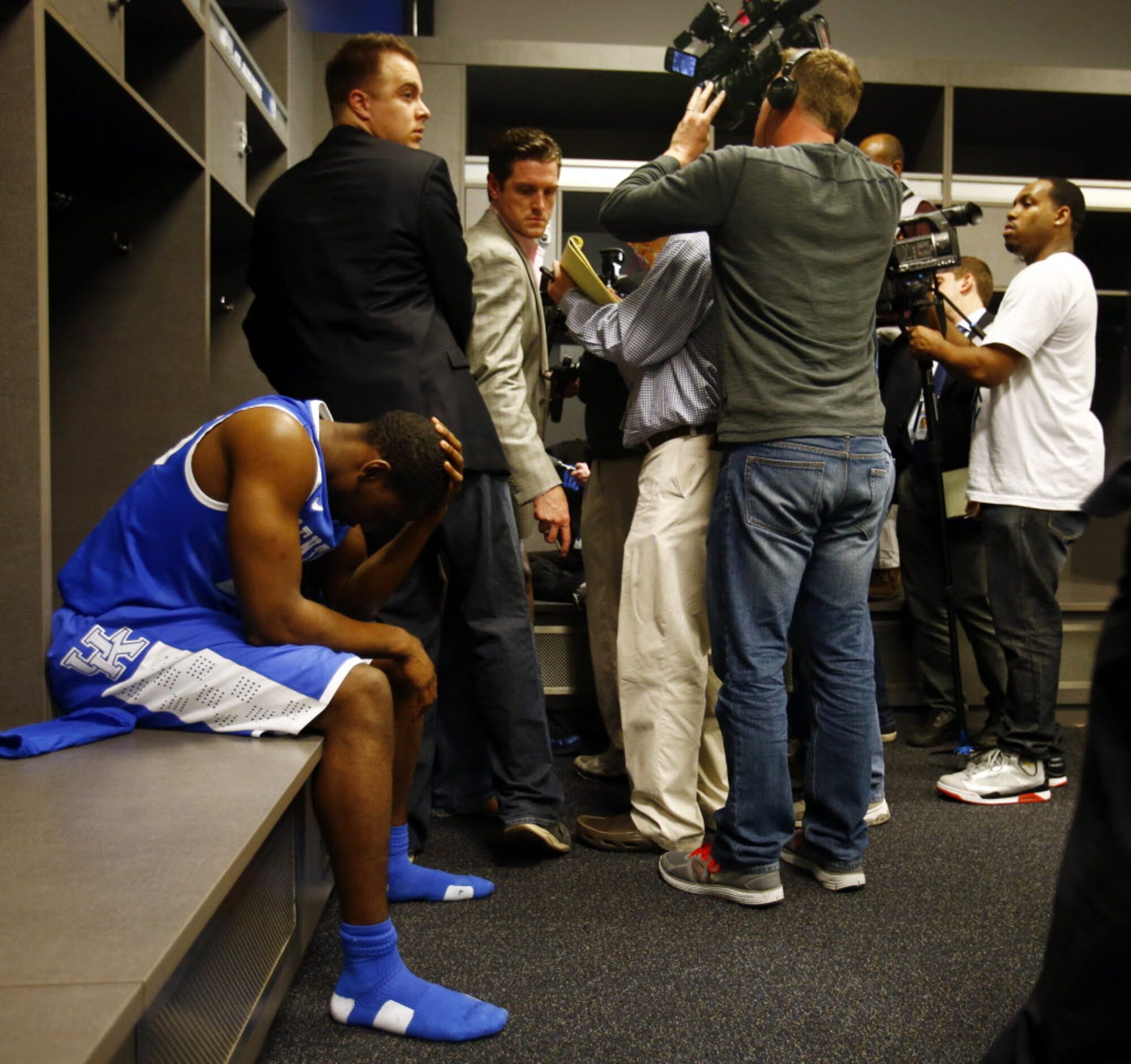 Kentucky Wildcats guard Dominique Hawkins (25) sits dejectedly following a 60-54 loss to the...