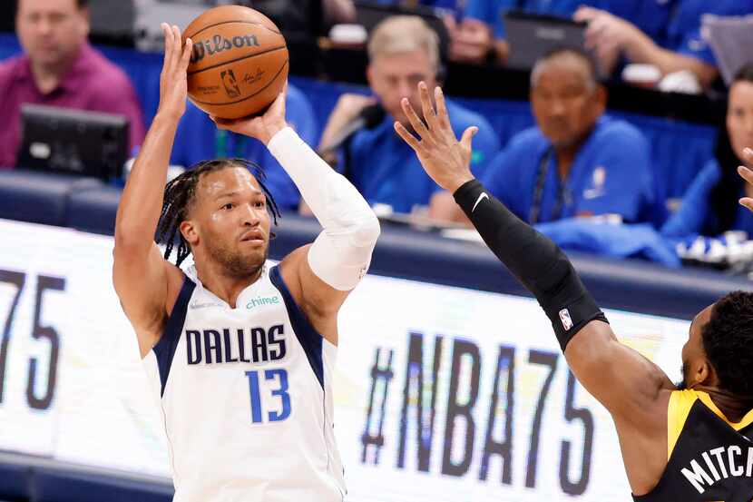 Dallas Mavericks guard Jalen Brunson (13) nails a there-pointer early in the first quarter...
