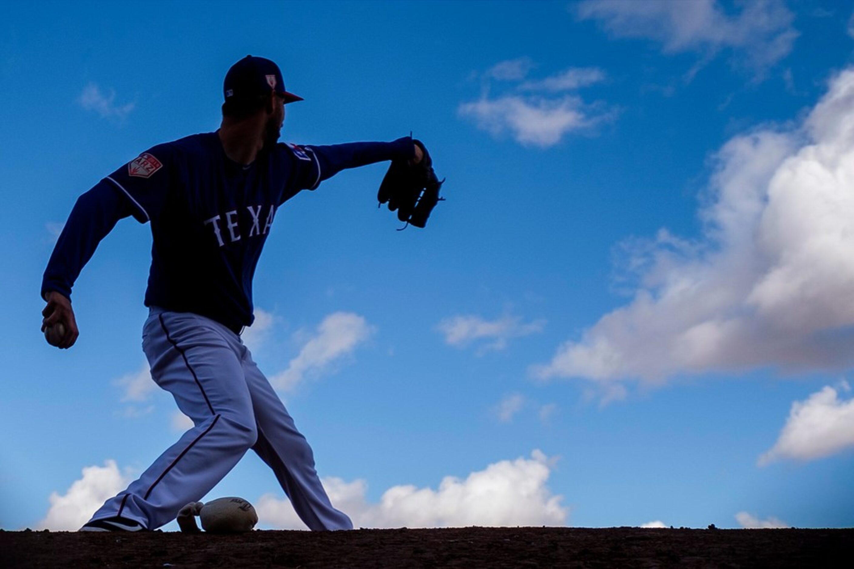 Texas Rangers pitcher Chris Martin throws in the bullpen during the first full squad spring...