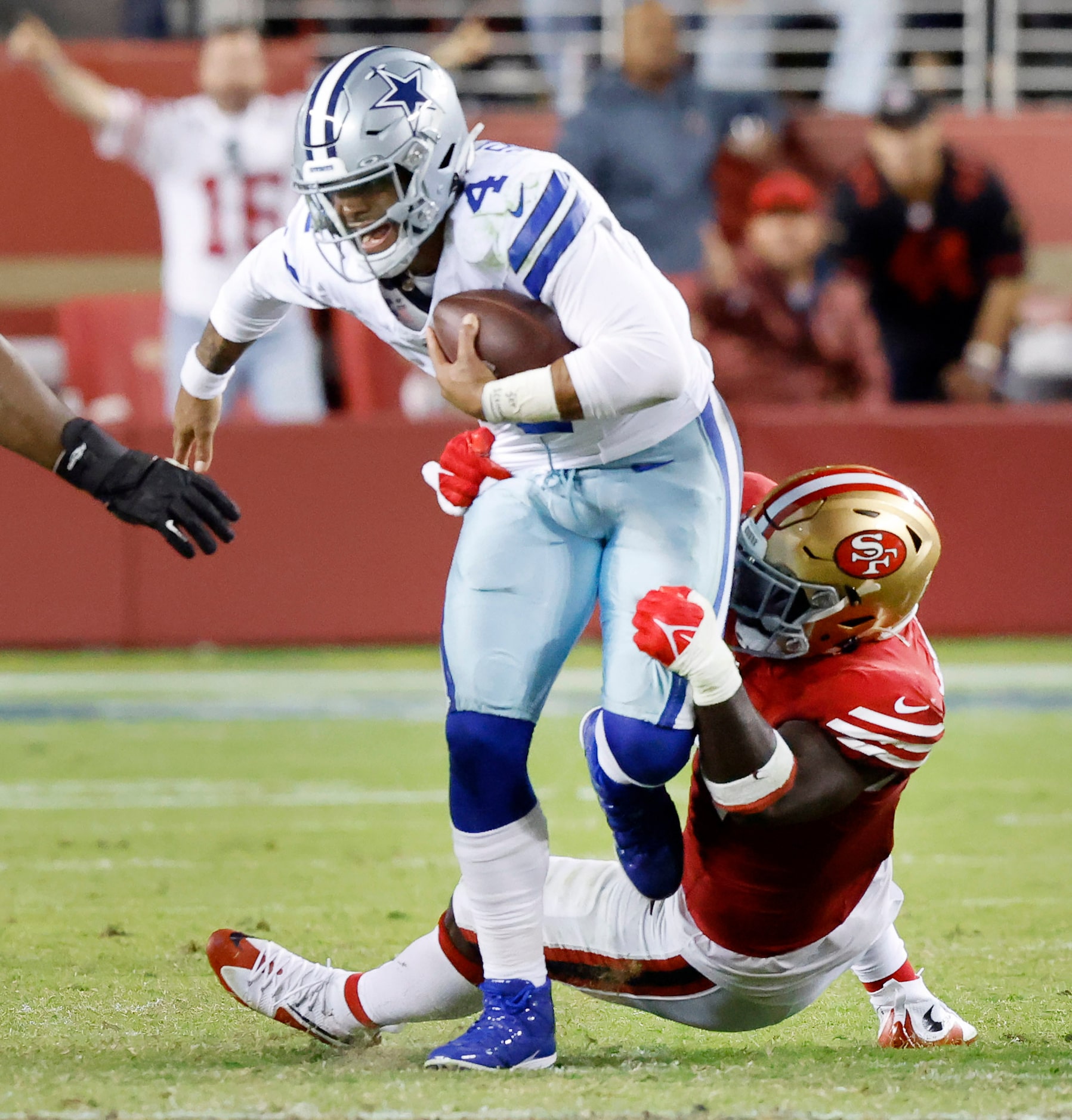 San Francisco 49ers defensive tackle Sam Okuayinonu (91) sacks Dallas Cowboys quarterback...